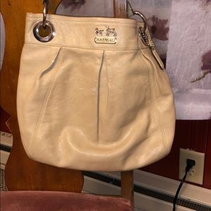 Tan leather coach hobo bag.  Clean, smooth, yes.